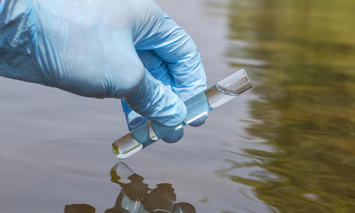 Lab technician holding vials
