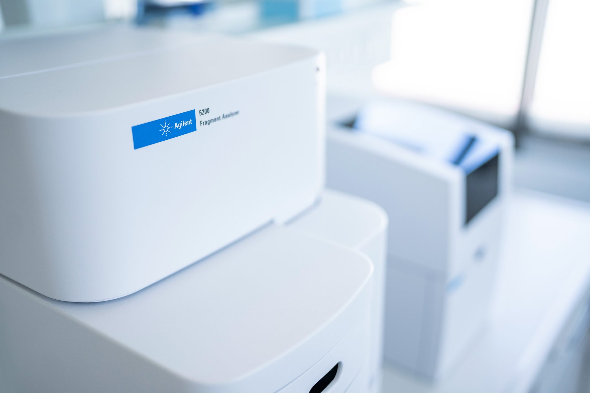 Sample QC lab with close-up of Agilent 5200 Fragment Analyzer and 4150 TapeStation in the background