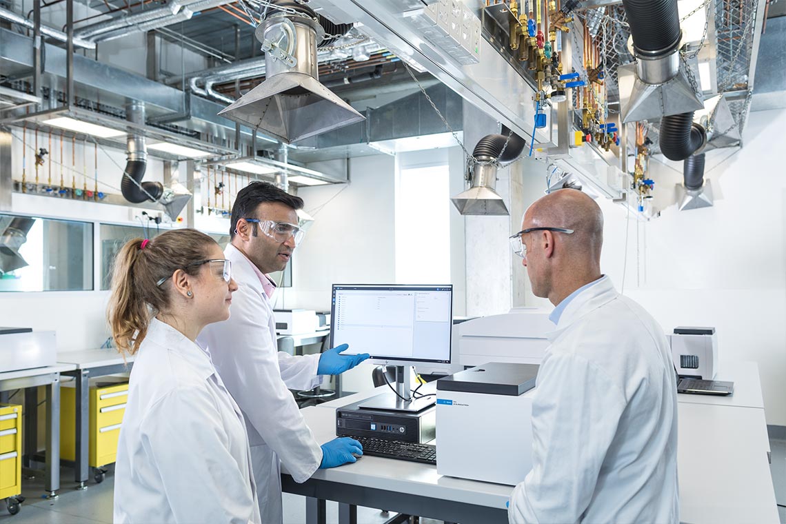 CrossLab specialist working with two lab technicians