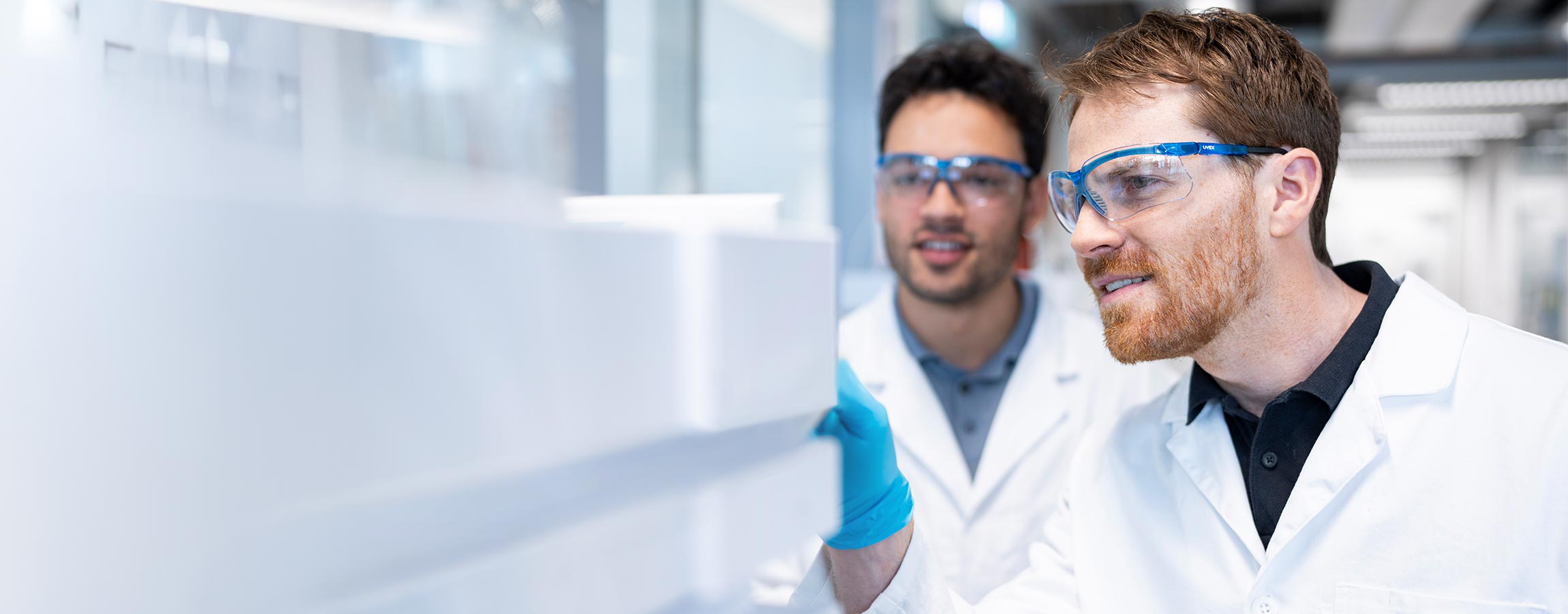 Two happy lab technicians using a new Agilent system