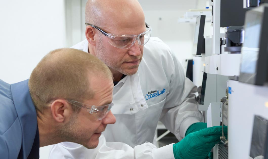Agilent CrossLab specialist with a lab technician