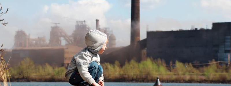 Child looking at factory